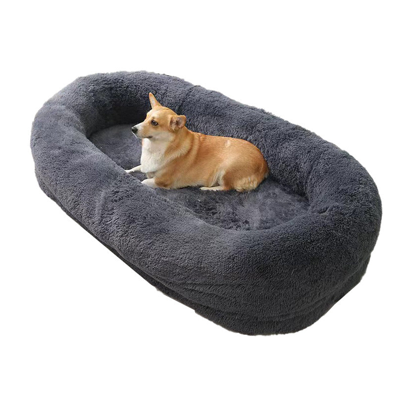 A large white plush pet bed with a removable mattress, shown with a person cuddling a dog inside.