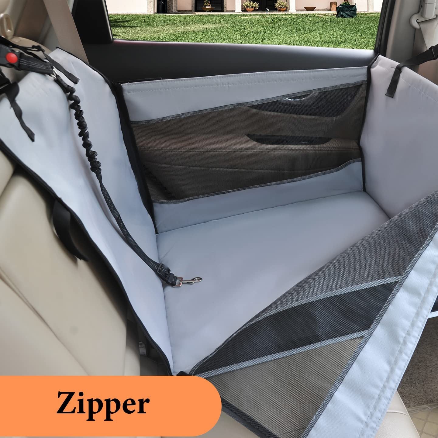 Car seat cover with zipper detail on a vehicle interior.