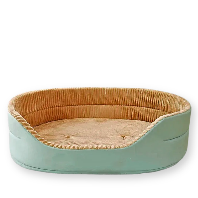 Pet bed with green exterior and brown interior on a white background