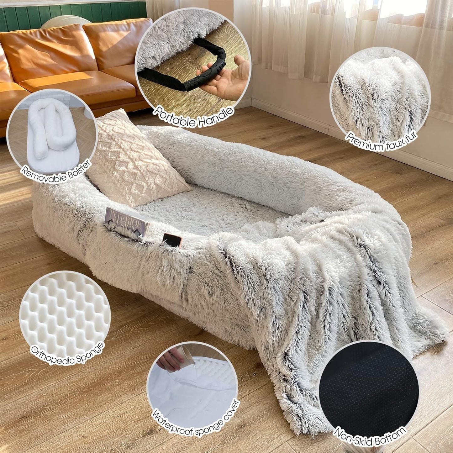 Portable pet sofa with handle and removable cover on wooden floor.