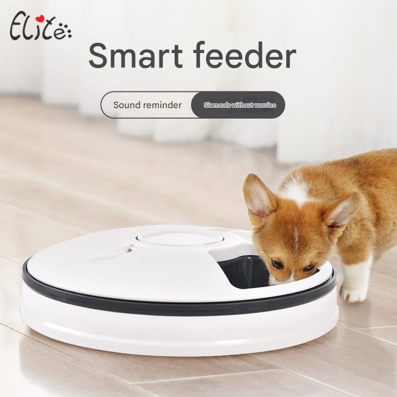 Smart feeder with a dog interacting with it on a tiled floor, featuring the Elite brand.