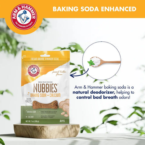 Arm and Hammer Nubbies peanut butter dog dental treats next to a spoon of baking soda for bad breath control