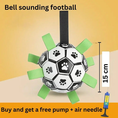 Bell-sounding football dog toy with green carrying straps and size measurements on yellow