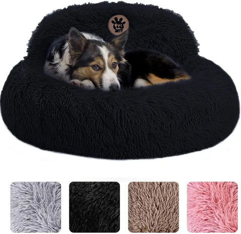 Medium dog resting inside a black plush calming donut pet bed with raised backrest
