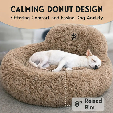 Sleeping dog in a plush tan calming donut bed featuring an 8-inch raised rim