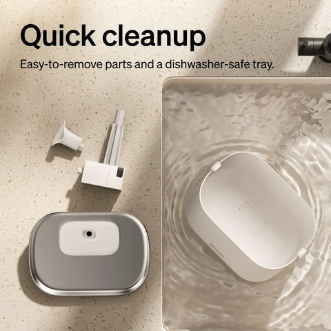 Disassembled PETLIBRO fountain parts being washed in a sink to demonstrate quick cleanup.