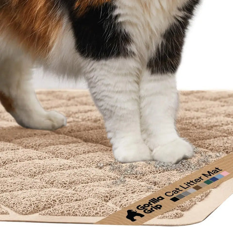 Close-up of cat paws stepping onto a beige Gorilla Grip cushioned litter trapping mat
