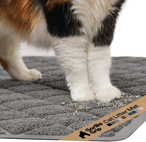 Close-up of cat paws stepping onto a grey Gorilla Grip cushioned litter trapping mat
