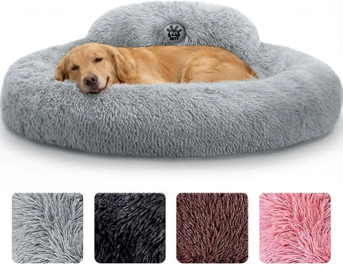 Golden retriever lying down in a large light gray plush calming donut dog bed