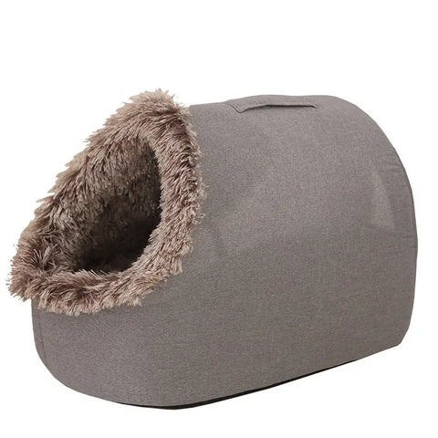 Gray pet bed with fluffy interior on white background.
