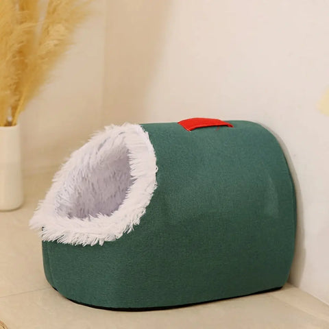 Green pet bed with white interior and size chart on beige background.