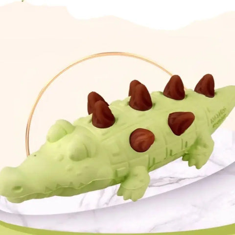 Pawvortex green dinosaur dog toy with brown spikes on white background, showing durable chew toy for interactive play and teething relief for dogs