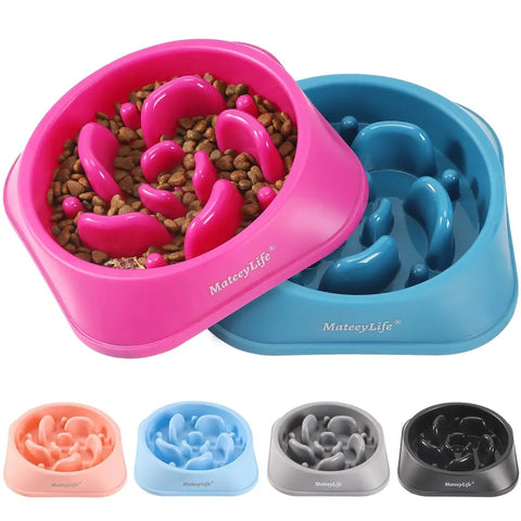 A side-by-side view of a hot pink and a deep blue slow feeder bowl for color selection comparison.