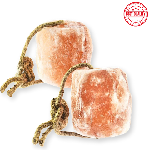 Two pink Himalayan salt rocks with rope on a white background.