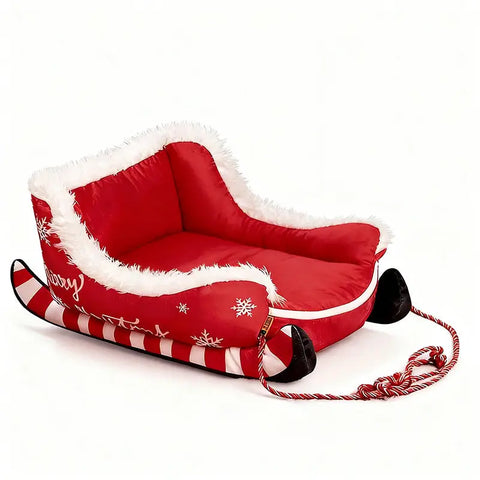 Red and white sled with decorative elements on white background.
