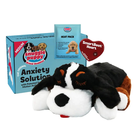 Snuggle Puppy Breed Buddies anxiety solution kit featuring a tricolor black, white, and brown plush dog toy with a SmartBeat Heart.