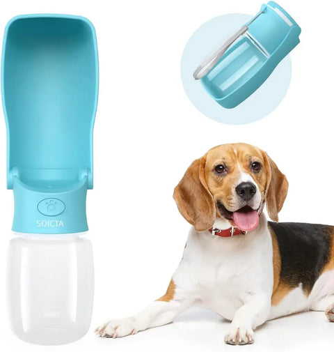 Lake blue 12 oz fold-out dog water bottle dispenser next to a happy Beagle