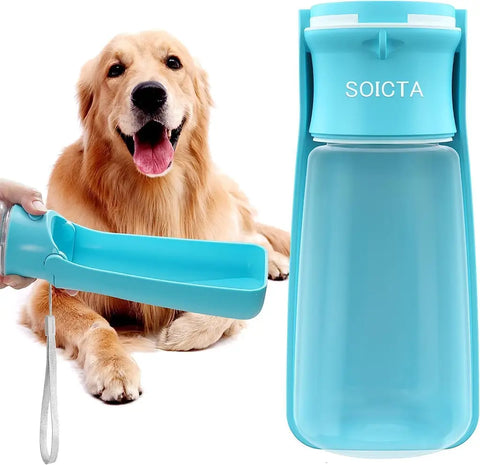 Blue portable dog water bottle dispenser held out for a Golden Retriever