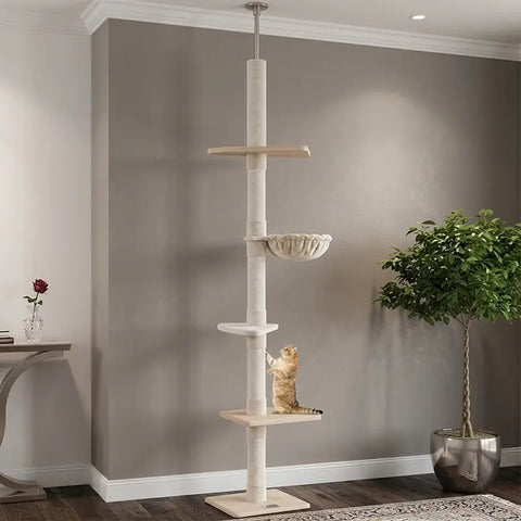 Tall floor-to-ceiling cat tower with scratching posts and a cat climbing in a living room setting