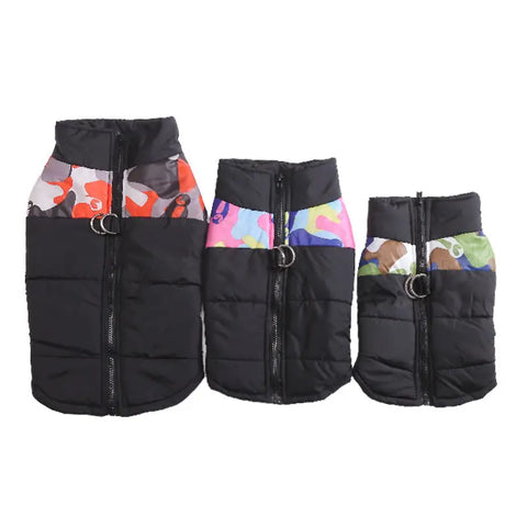 Three black puffer dog vests with colorful inner lining.
