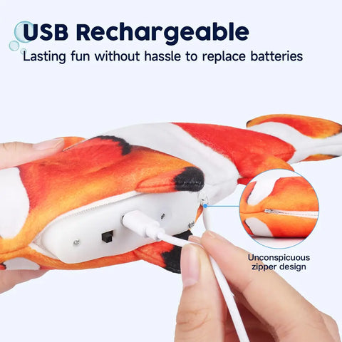 USB charger plugged into the hidden mechanism of the orange clownfish cat toy.