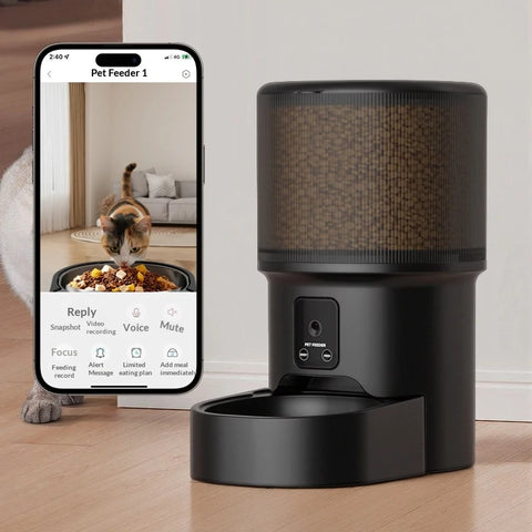 Smart Wi-Fi pet food dispenser next to a smartphone displaying companion app controls for video recording, voice commands, and feeding schedules.