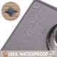 100 percent waterproof gray dog bowl placemat showing water containment and easy-to-drain flexible design.