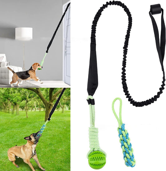 A black dog tug-of-war rope with a green ball attached, shown in use with a dog pulling on it.