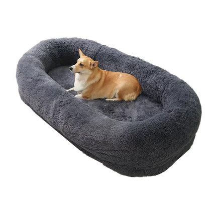 A large white plush pet bed with a removable mattress, shown with a person cuddling a dog inside.