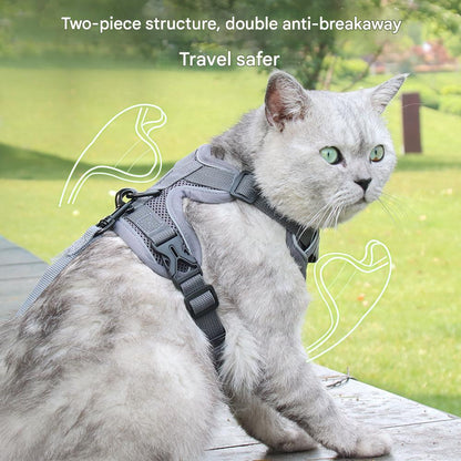 Cat wearing a gray harness with text about safety features, sitting on a wooden deck with a grassy background.