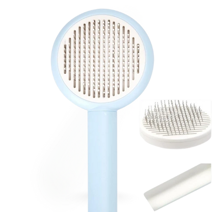 Pet grooming brush with blue handle and white bristles on a white background