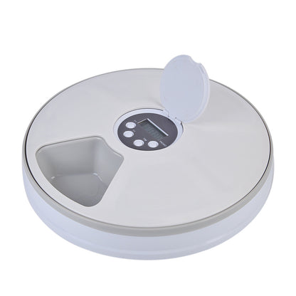Round electronic device with digital display on a white background