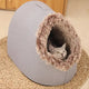 Alpine retreat pet bed with fluffy lining and semi-enclosed structure.