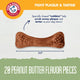 Close up of a two and a half inch peanut butter flavor Arm and Hammer Nubbies dog dental chew bone