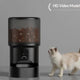 HD Video model of the black automatic pet feeder featuring a built-in front-facing camera, with a fluffy cat waiting for food.