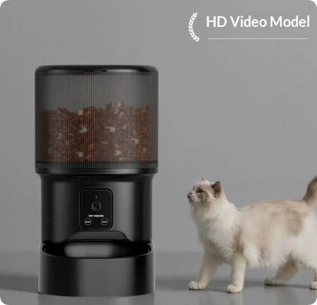 HD Video model of the black automatic pet feeder featuring a built-in front-facing camera, with a fluffy cat waiting for food.