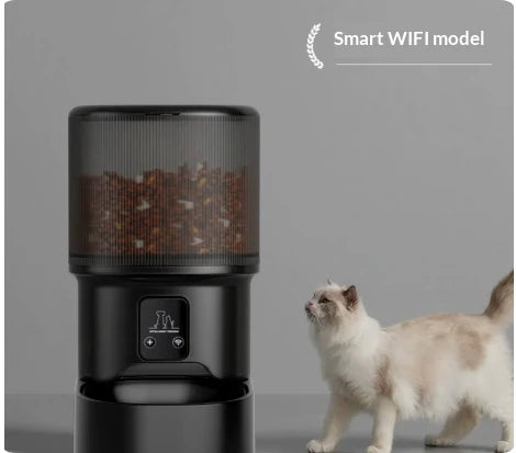 Smart WIFI model of the black automatic pet feeder showing a digital display with a Wi-Fi connectivity indicator, with a cat nearby.