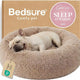 Bedsure camel plush round dog bed with a French bulldog lying down comfortably inside the soft rim.