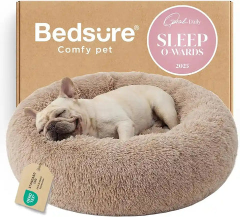 Bedsure camel plush round dog bed with a French bulldog lying down comfortably inside the soft rim.
