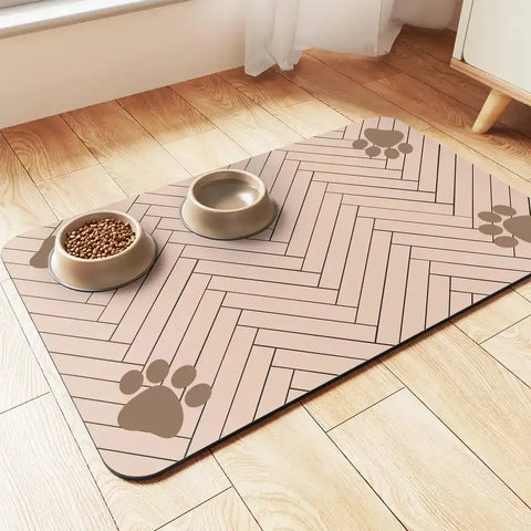 Beige absorbent pet feeding mat with brown paw print accents for dogs and cats.