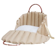 Beige pet carrier with a plush white cushion interior for neutral luxury travel