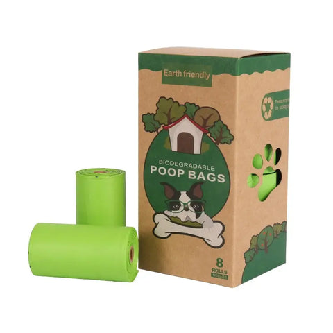 Biodegradable poop bags with a cardboard box on white background.