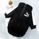 Black dog hoodie with Puma logo on light gray background.