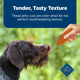 Close up of a dog licking its nose while being offered a tender, oven-dried Blue Buffalo jerky cut treat.