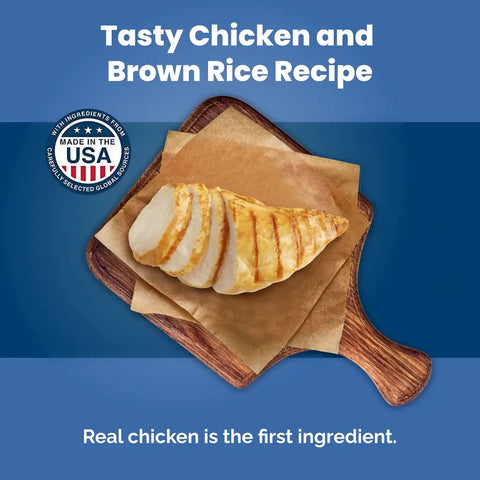 Close-up of grilled chicken breast on a wooden board labeled real chicken is the first ingredient