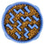 Close-up top view of a blue zig-zag maze slow feeder bowl filled with dog food.