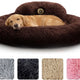 Large golden retriever resting in a plush dark brown round donut dog bed