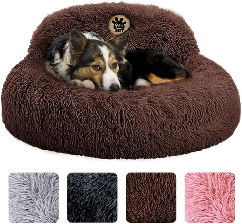 Medium dog resting comfortably in a dark brown plush calming donut bed