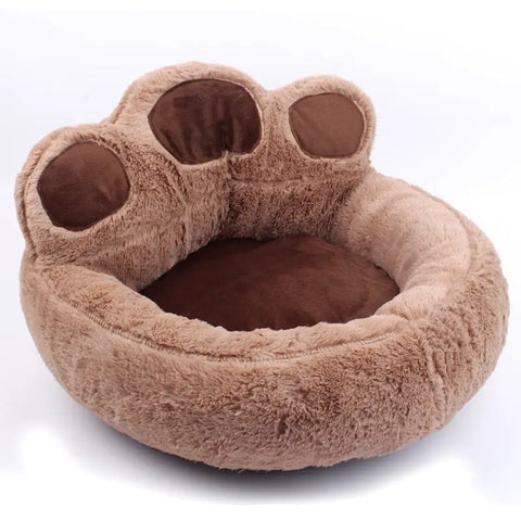 Brown paw-shaped pet bed on white background view.