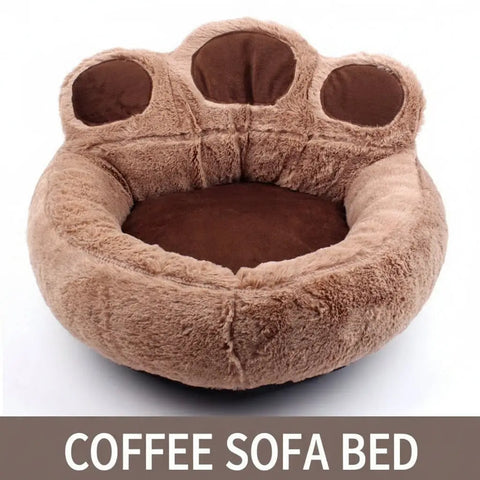 Brown paw-shaped pet bed on white background.